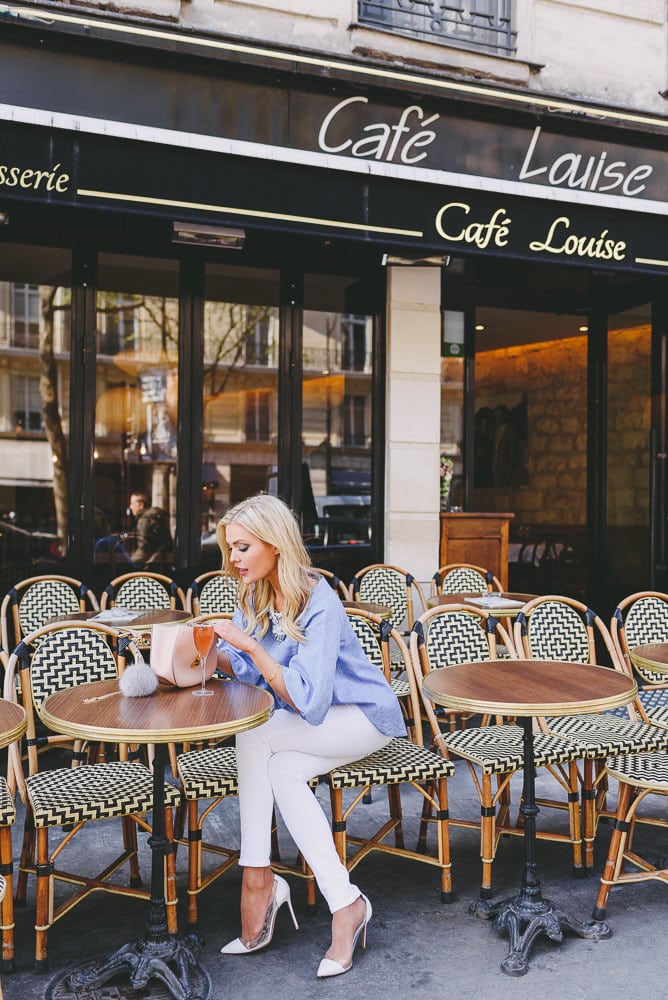 Blond fashionista sitting at Cafe Louise with Chloe purse