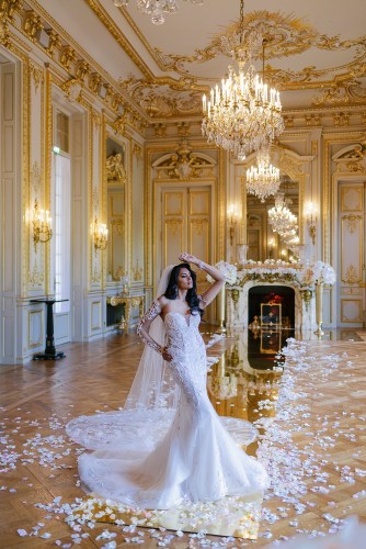 Bride posing in the ceremony spot on the day of her elopement in Shangri La Paris
