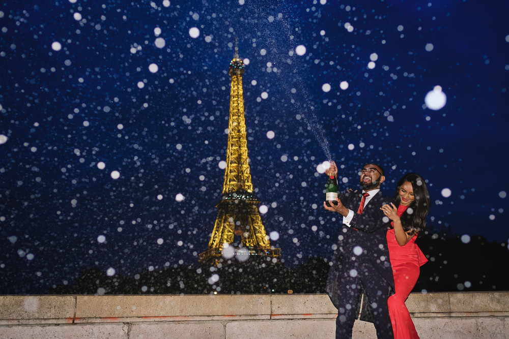 Champagne shower during engagement photo session in Paris