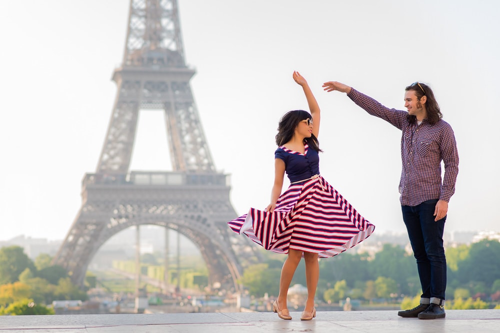 Couple dancing in front of the Eiffel Tower