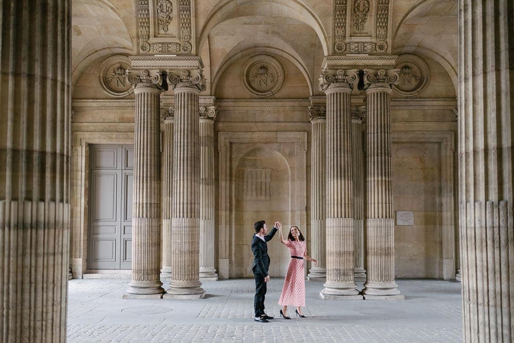 Couple honeymoon in Paris - dancing surrounded by elegant architecture