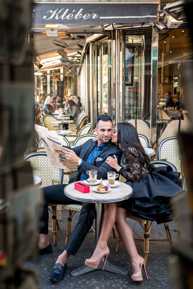 couple photography images of gentleman reading newspaper in a parisian cafe