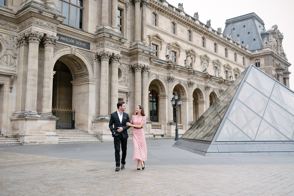 couple photoshoot ideas - walking hand in hand around the Louvre Museum in Paris