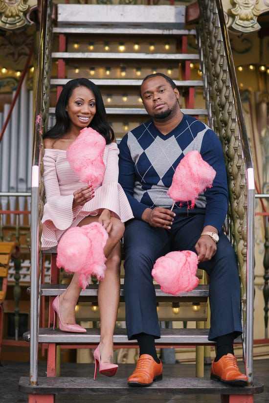 Cute black couple fun photo with cotton candy in Paris