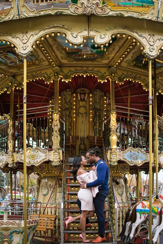 Cute couple photo shoot on the merry go round near the Eiffel Tower in Paris