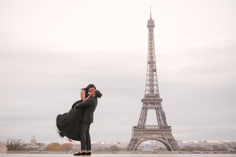 Cute couple photoshoot in Paris - Elegant gentleman lifting his girlfriend and having a romantic moment