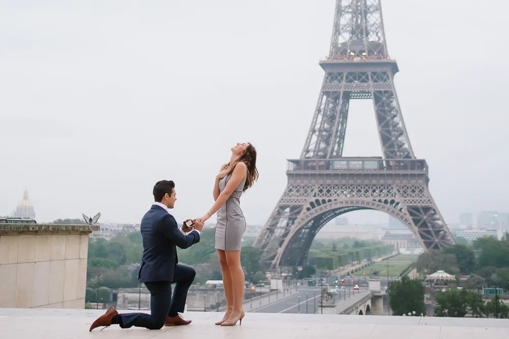 Eiffel Tower proposal - Man on his knee asking his girlfriend to marry him