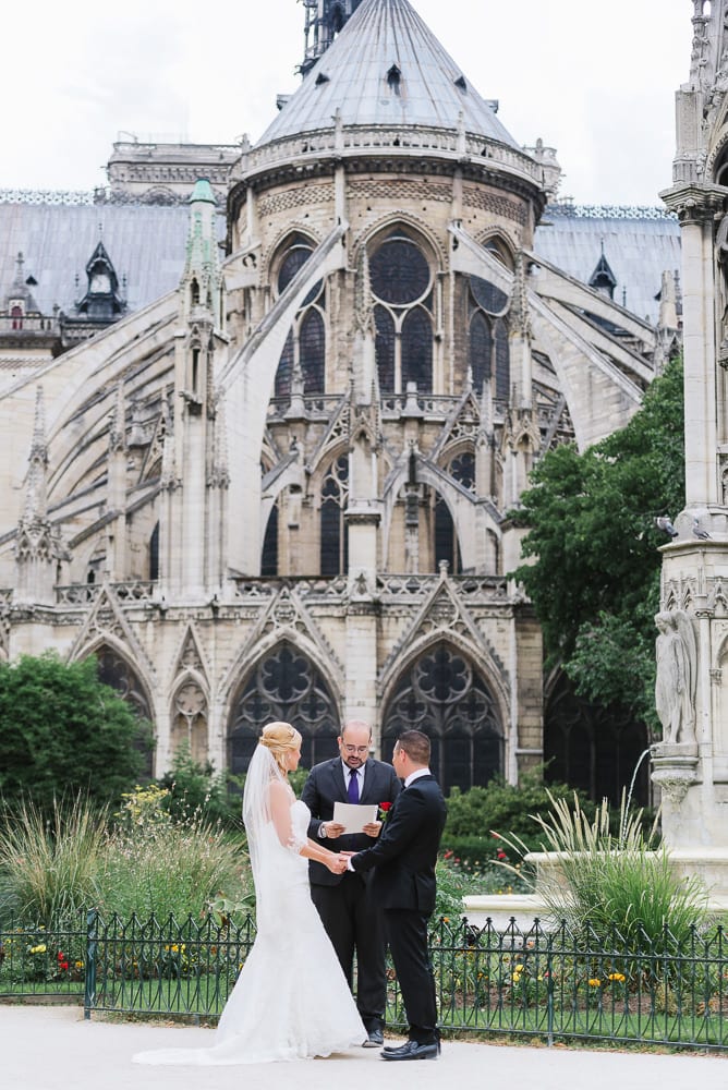 Elopement in Paris behind the Notre Dame Cathedral in Square Jean XXIII