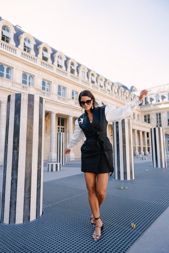 Fashionista posing for social media photos at Palais Royal
