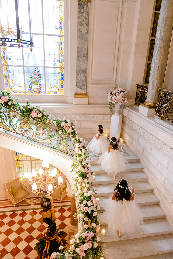 Flowr girls and wedding decoration on the staircase of Shangri La Paris