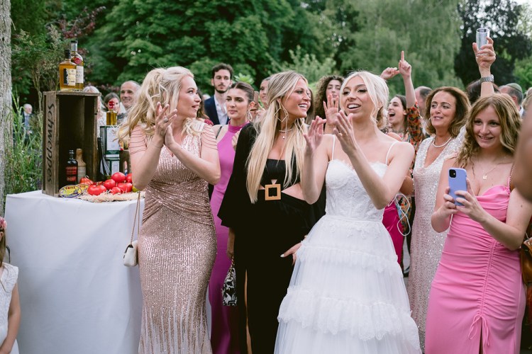 Guests having fun at party with bride