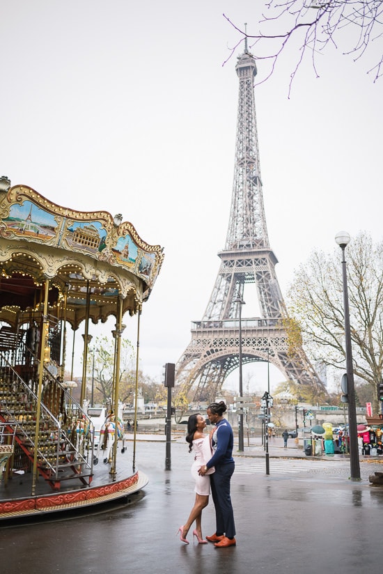 Kissing in the street near the Carousel of the Eiffel Tower