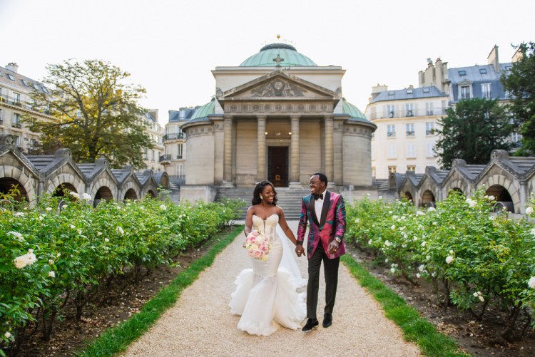 Newly married happy couple walking out of their marriage ceremony in Paris at the Chapelle Expiatoire
