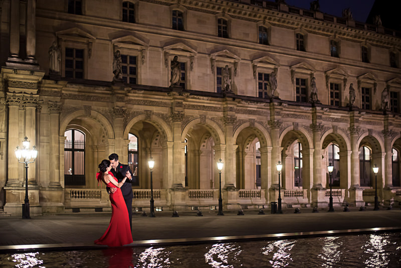 Engagement photos at night at Louvre Museum