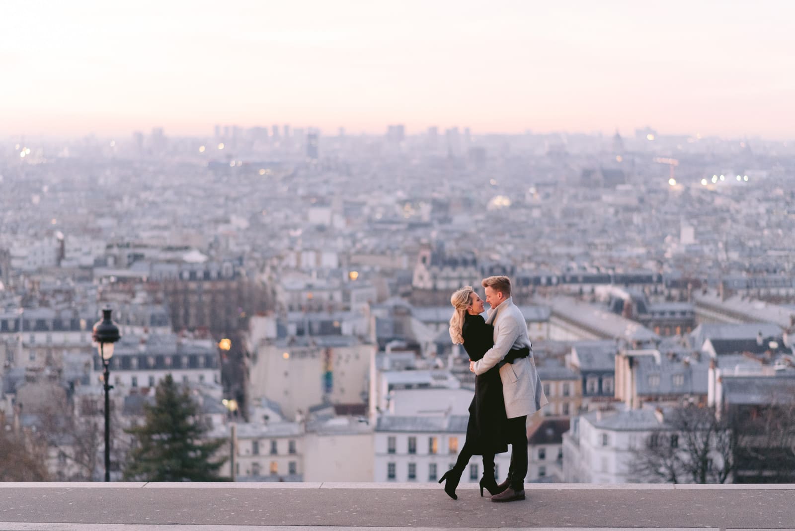 Paris proposal photographer - Engagement photos at Montmartre overlooking the city of Paris