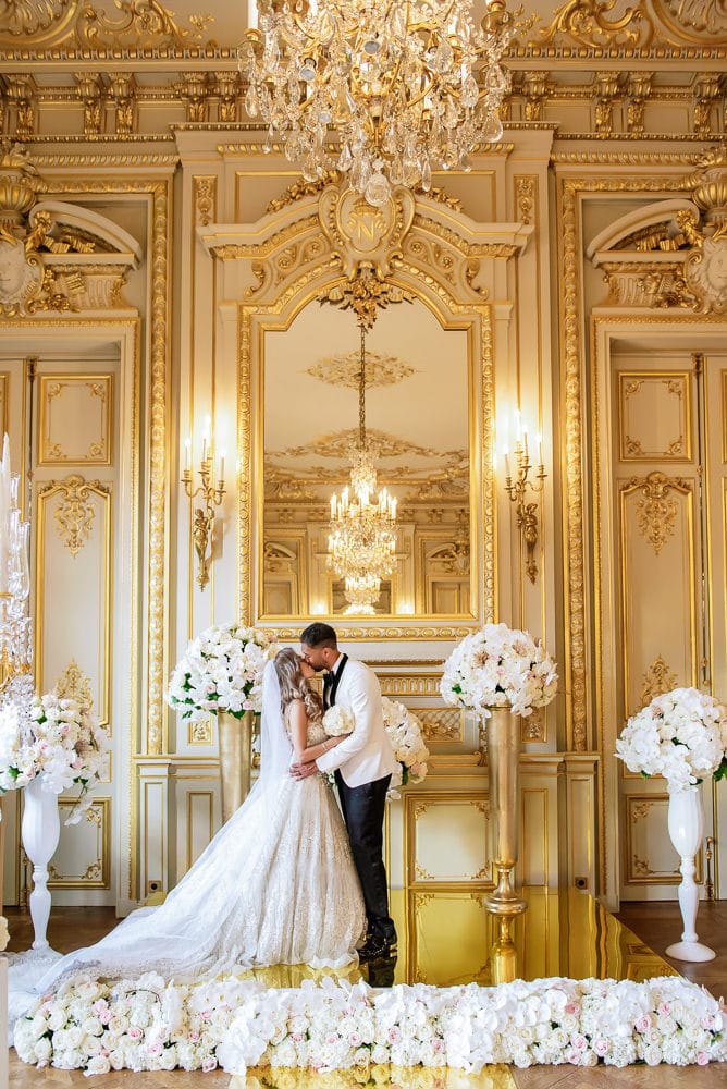 Paris wedding - bride and groom kissing during ceremony at Shangri La hotel in Paris