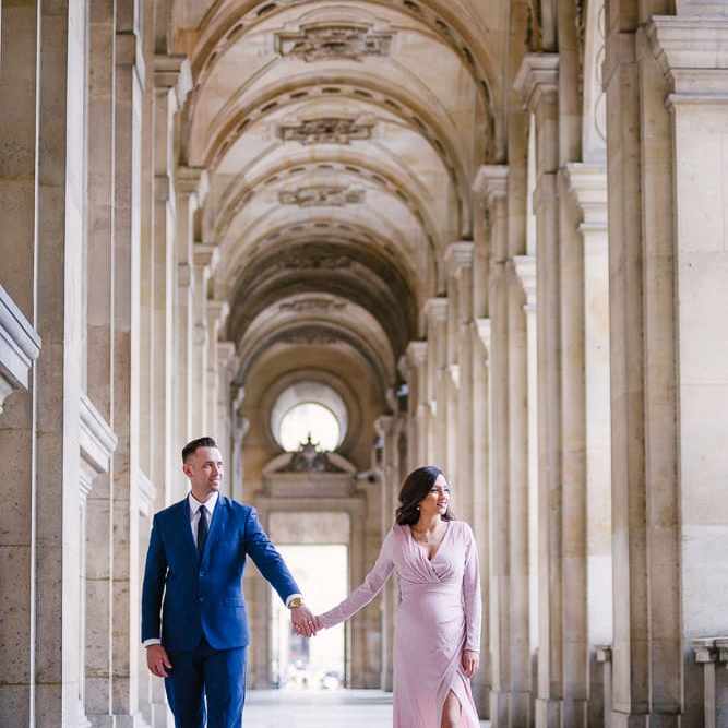 Parisian photographer captures couple walking in Paris surrounded by gorgeous architecture