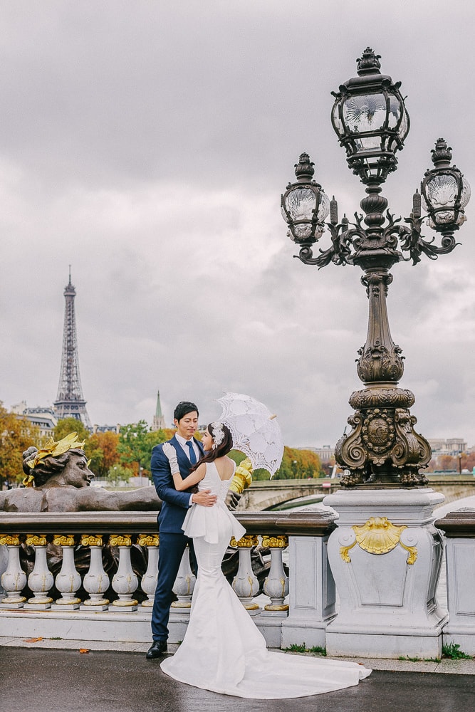 pre wedding photo shoot in paris on the alexander 2 bridge with bride and groom dancing