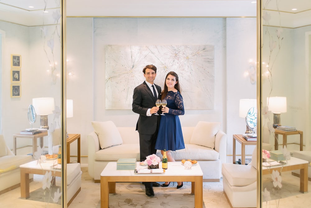 Recently engaged couple celebrating their engagement at Tiffany's on the champs elysees in Paris