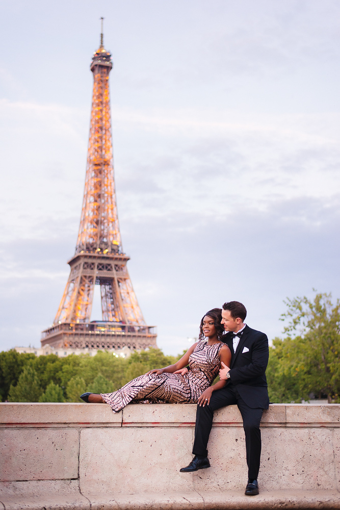 Romantic couple posing for photos by the Eiffel tower