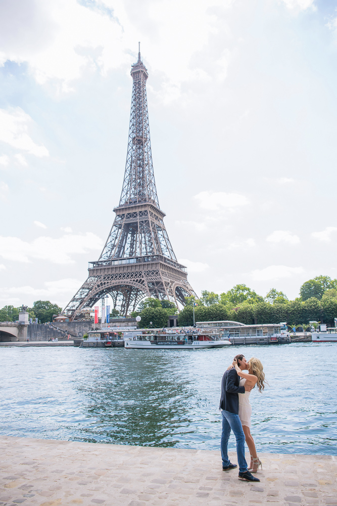 Romantic kiss by the river and Eiffel tower in paris