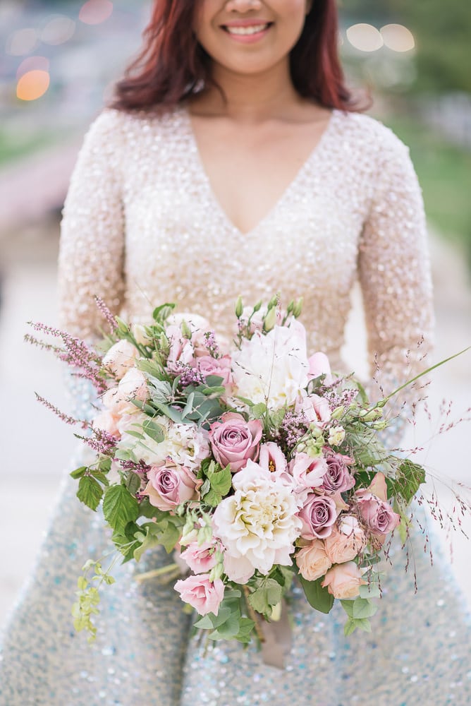 sophisticated wedding bouquet and designer wedding dress