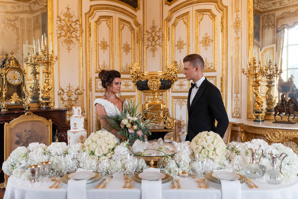 Wedding in France - Bride and groom looking at each other in their French wedding reception venue: Chateau de Chantilly